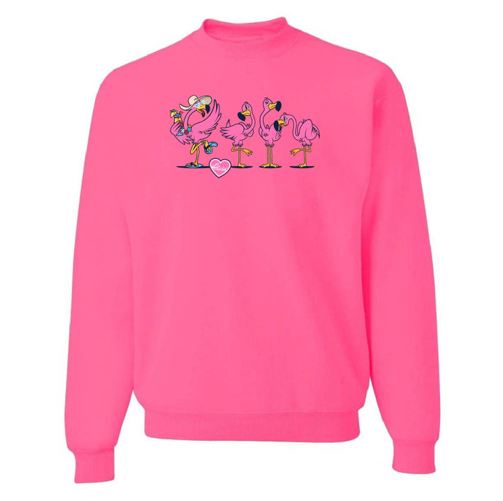Pink sweatshirt with cartoon flamingos design on a white background