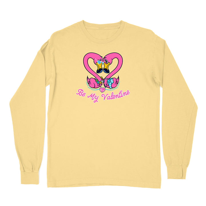 Yellow long-sleeve shirt with Valentine's Day design featuring flamingos and 'Be My Valentine' text on a white background.
