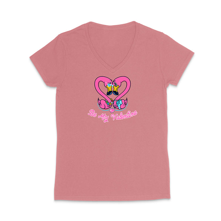 Pink t-shirt with cartoon design and text on a white background
