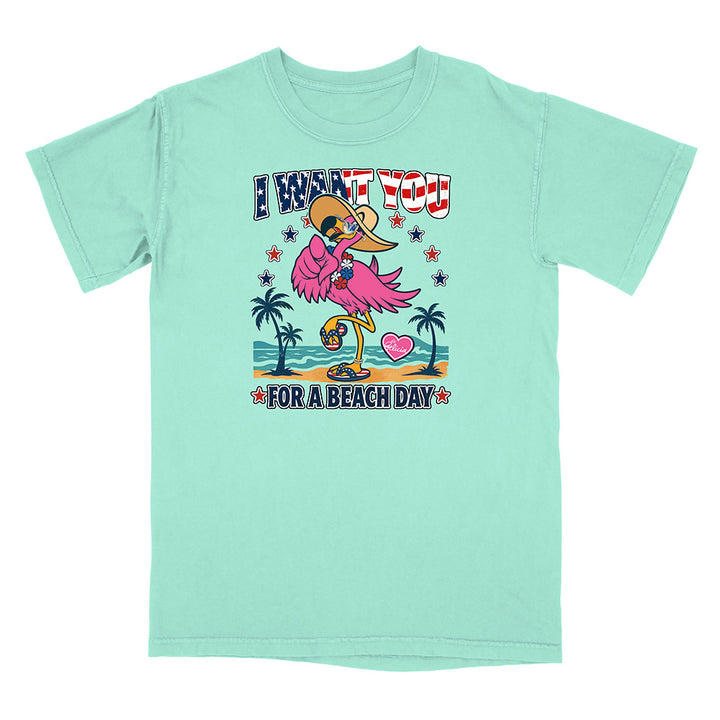 Mint green t-shirt with a flamingo graphic and text on a white background
