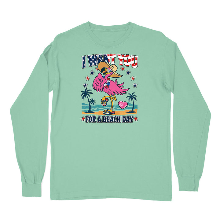 Mint green long-sleeve shirt with a flamingo graphic and text on a white background