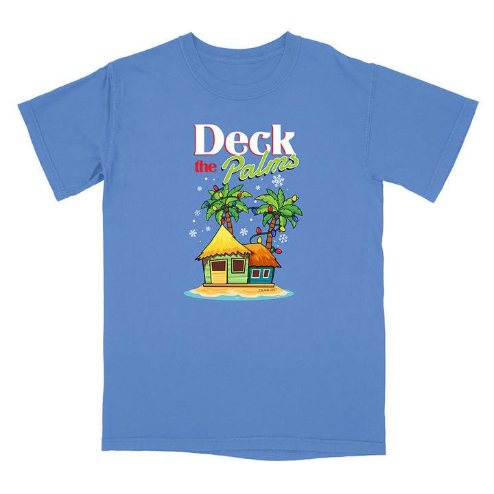 Blue t-shirt with a tropical hut and palm tree design with graphic text reading "Deck The Palms" on a white background