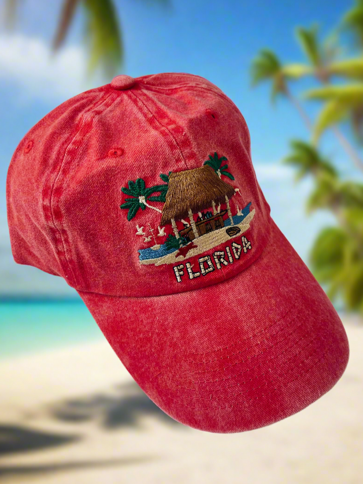 Red baseball cap with the stitched image of a tiki bar on it with "Florida" stitched under the bar.