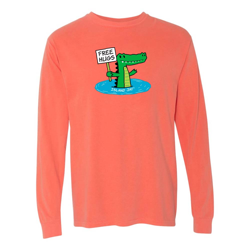 Light orange/red long-sleeve shirt with a cartoon alligator holding a 'Free Hugs' sign.