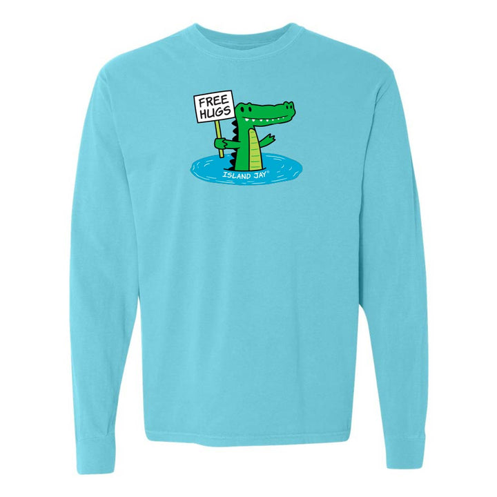 Blue long-sleeve shirt with a cartoon alligator holding a 'Free Hugs' sign.