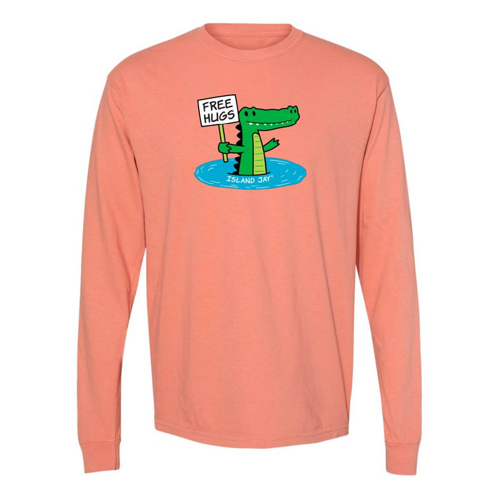 Light orange long-sleeve shirt with a cartoon alligator holding a 'Free Hugs' sign.