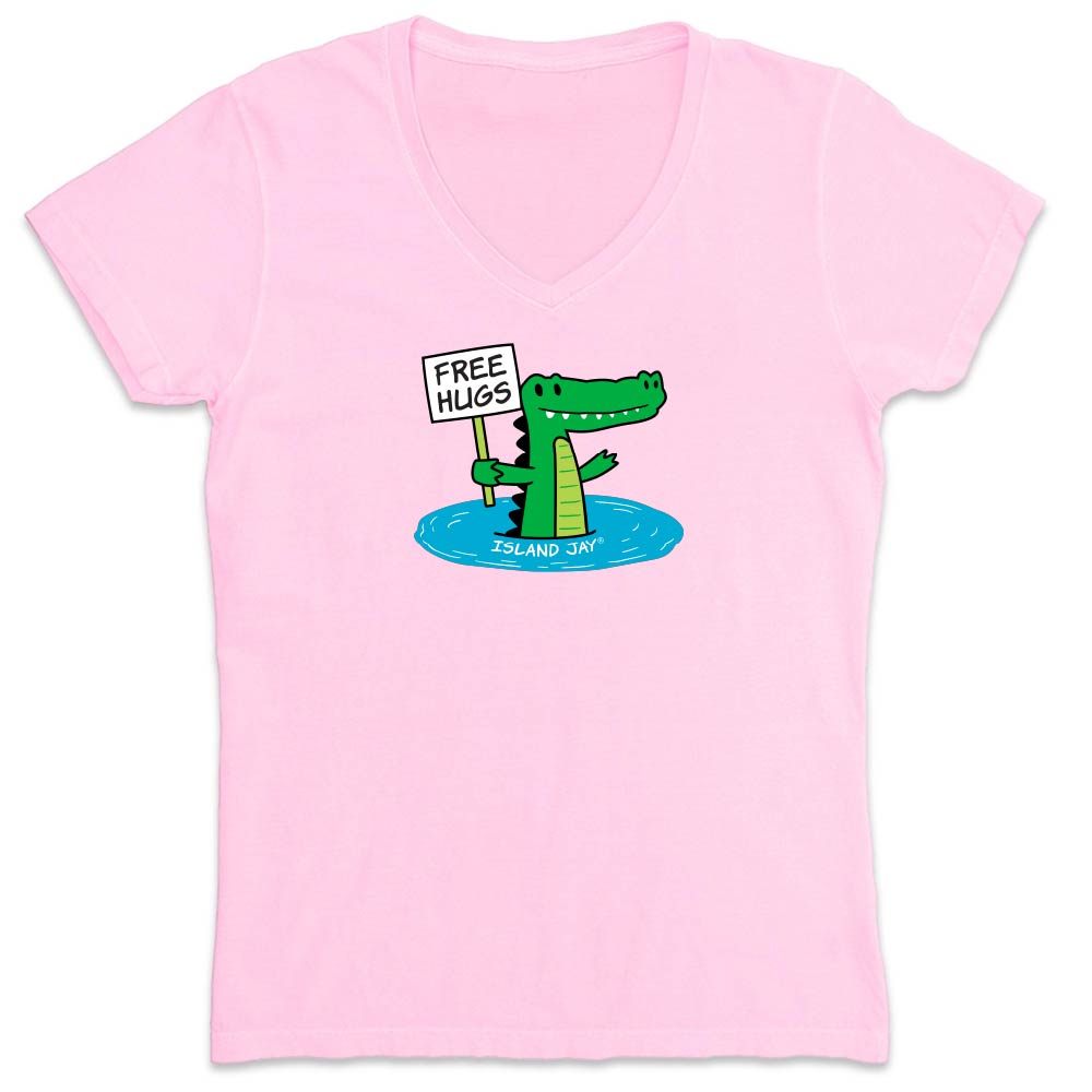 Pink shirt with cartoon alligator graphic and text reading "Free Hugs".