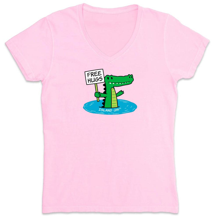 Pink shirt with cartoon alligator graphic and text reading "Free Hugs".