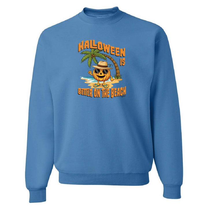 Blue sweatshirt with Halloween design featuring a pumpkin on a beach.