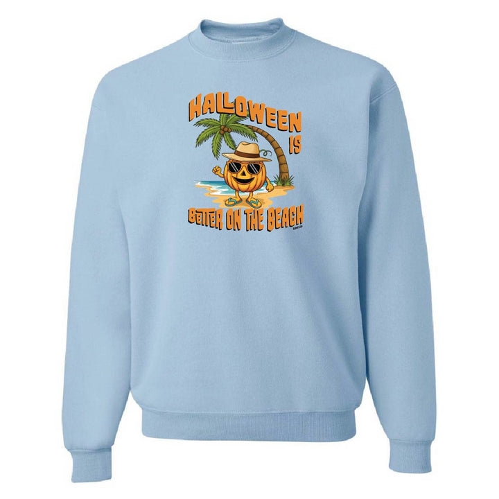 Light blue sweatshirt with Halloween design featuring a pumpkin, palm tree, and text on a white background.