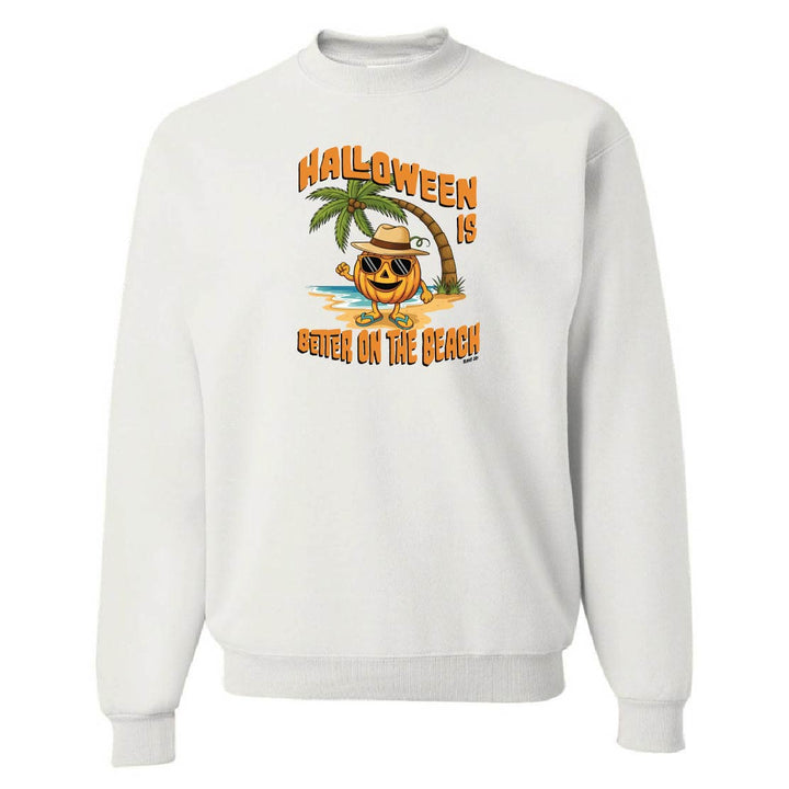 White sweatshirt with a Halloween design of a pumpkin on a beach.