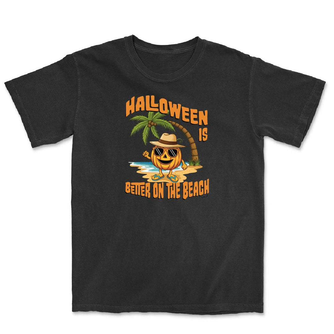 Black t-shirt with Halloween-themed design featuring a pumpkin, palm tree, and beach scene on a white background.