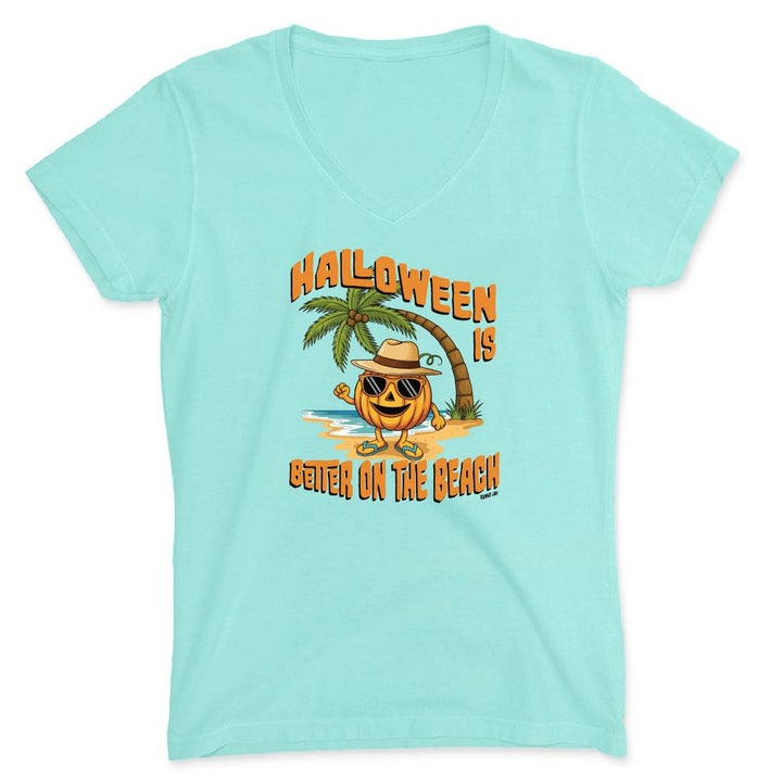 Light blue t-shirt with Halloween-themed design featuring a pumpkin, palm tree, and beach text on a white background.