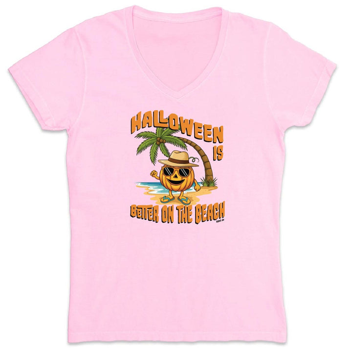 Pink t-shirt with Halloween-themed design featuring a pumpkin, palm tree, and beach scene on a white background.