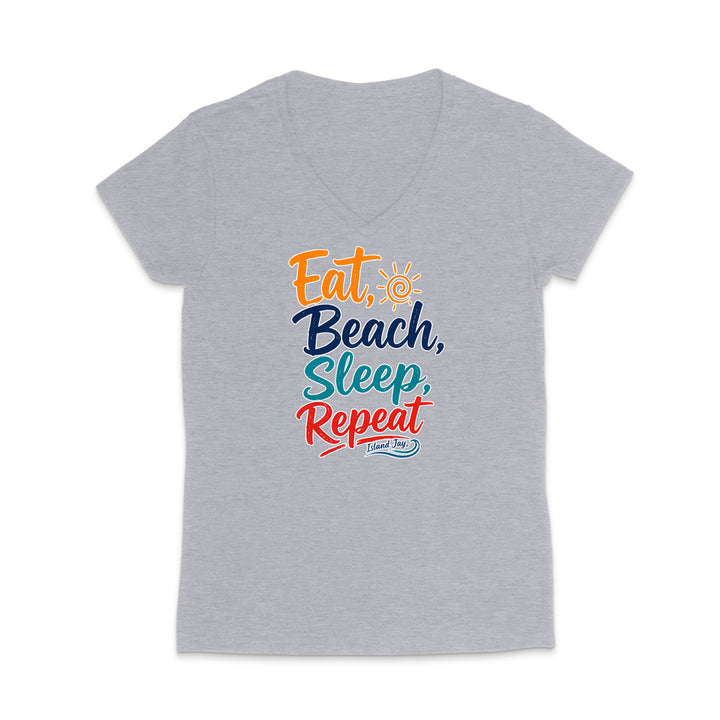 A heather gray V-neck t-shirt featuring a colorful graphic print on the front that reads 'Eat, Beach, Sleep, Repeat' with a small sun icon and 'I Love NY' written below.