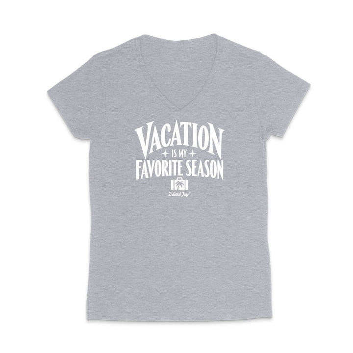 A heather gray short-sleeve V-neck t-shirt with a white graphic print on the front that reads 'VACATION IS MY FAVORITE SEASON' with a small 'Tulum Trip' logo underneath, displayed on a clean white background.