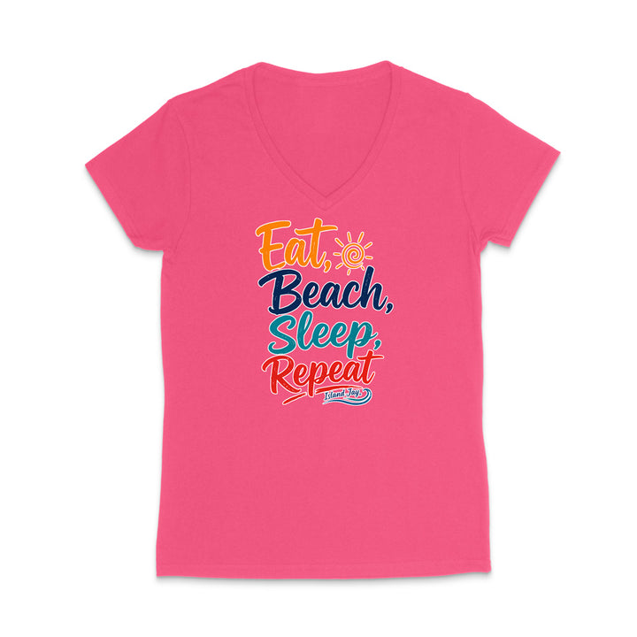 A bright pink women's V-neck t-shirt with a colorful graphic text design on the chest reading 'Eat, Beach, Sleep, Repeat' in orange, yellow, and teal lettering, with a small 'Sunny Side' logo underneath.