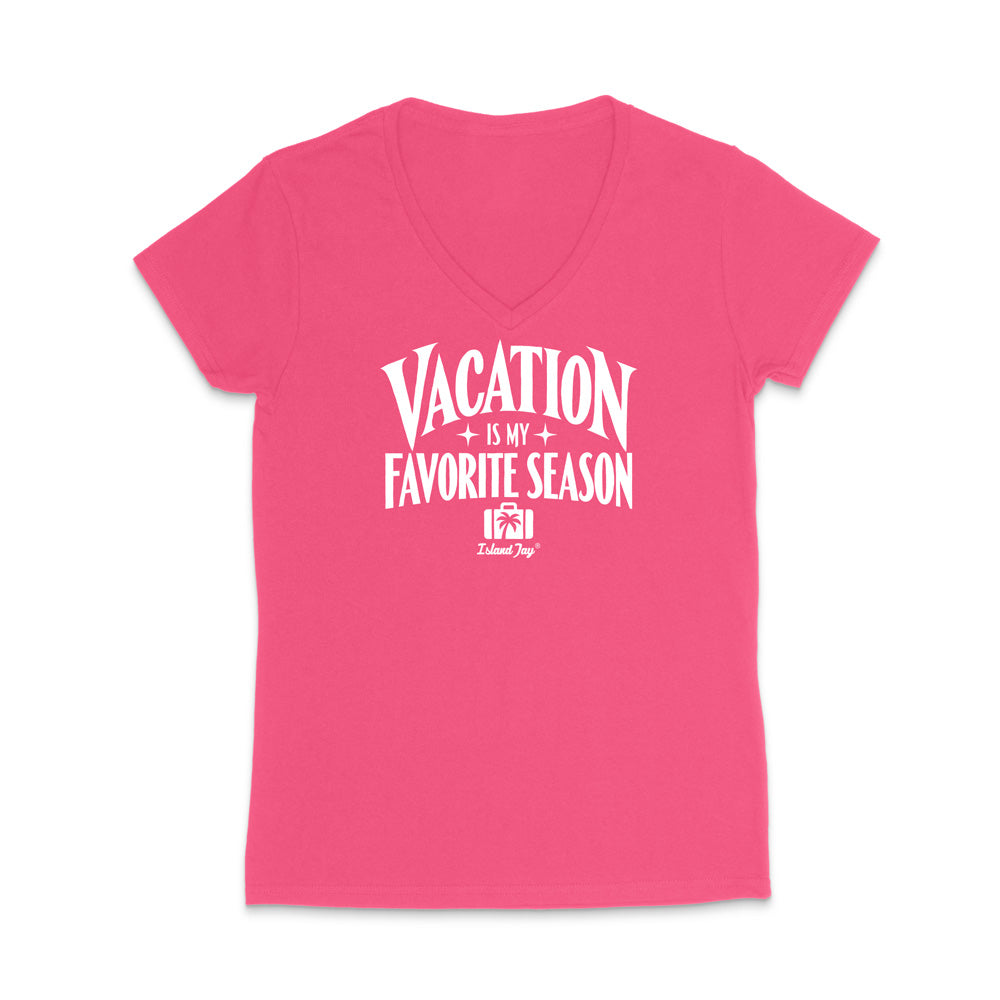 A bright pink women's V-neck t-shirt with a white graphic text print reading 'VACATION IS MY FAVORITE SEASON' and a small 'Island Shop' logo underneath, displayed on a clean white background.