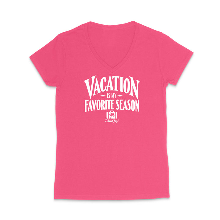 A bright pink women's V-neck t-shirt with a white graphic text print reading 'VACATION IS MY FAVORITE SEASON' and a small 'Island Shop' logo underneath, displayed on a clean white background.