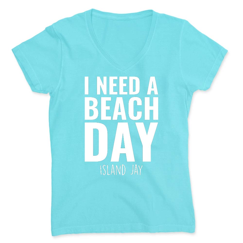 Light blue t-shirt with 'I NEED A BEACH DAY' text on a white background
