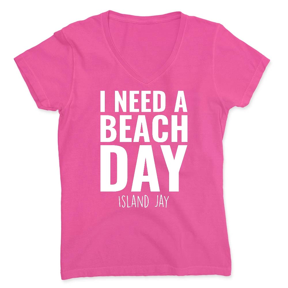 Pink t-shirt with 'I NEED A BEACH DAY' text on a white background