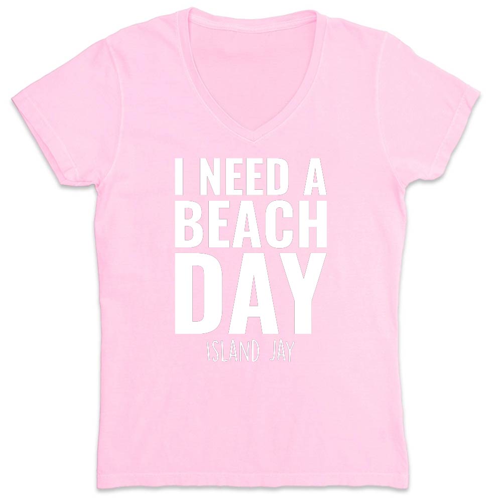 Pink t-shirt with 'I Need a Beach Day' text on a white background