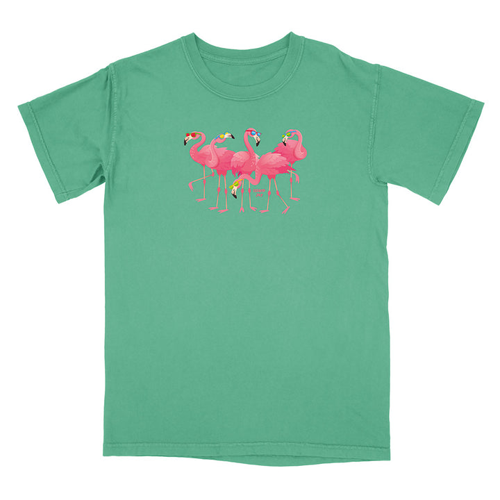 Green t-shirt with pink flamingo design on a white background