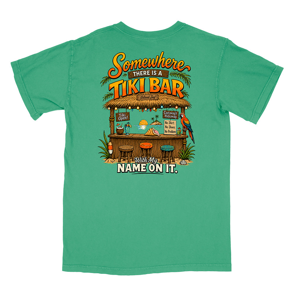 A green short-sleeve t-shirt shown from the back, featuring a large graphic print of a tropical tiki bar with parrots and the text 'Somewhere THERE IS A TIKI BAR with My NAME ON IT.'.
