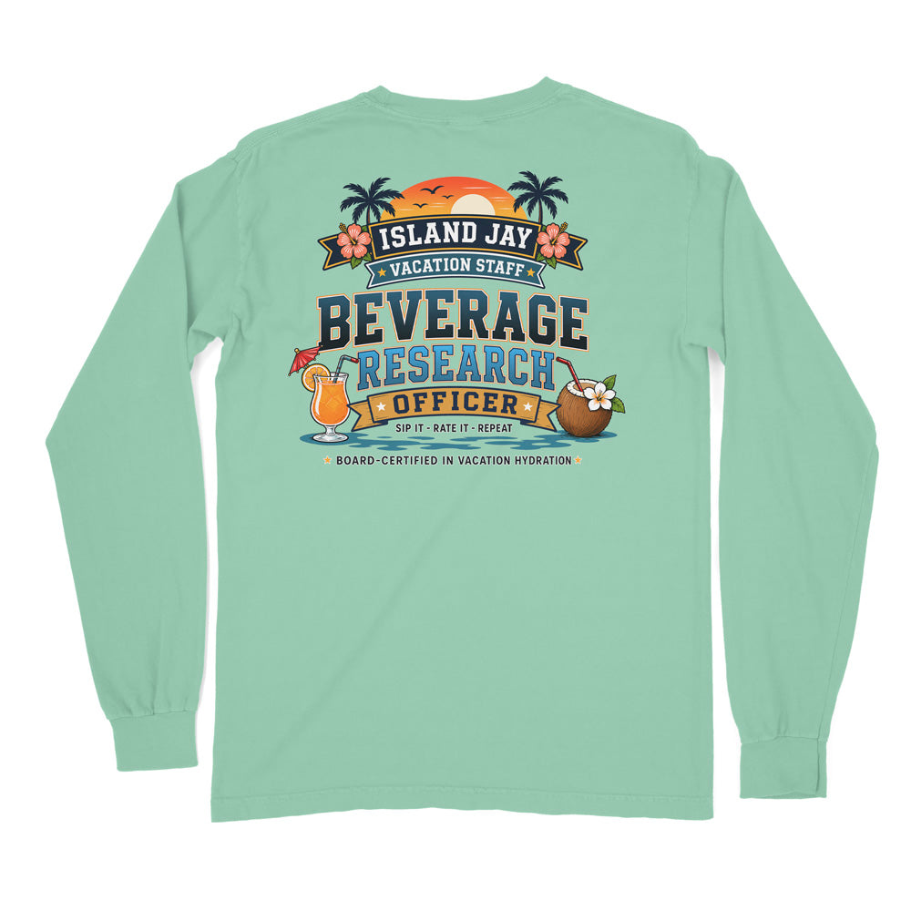 A mint green long-sleeve t-shirt shown from the back, featuring a colorful graphic print with tropical beach elements, a cocktail, a coconut drink, and the text 'ISLAND JAY BEVERAGE RESEARCH OFFICER'.