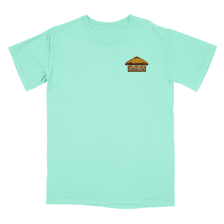 A mint green short-sleeve t-shirt with a small graphic on the left chest depicting a thatched-roof hut with the text 'Mukutai'. The shirt is displayed flat against a solid white background.
