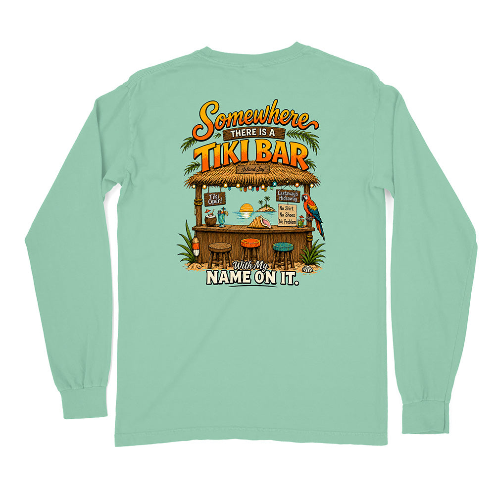 A mint green long-sleeve t-shirt shown from the back, featuring a colorful graphic of a tropical tiki bar with the text 'Somewhere There Is A TIKI BAR' and 'With My NAME ON IT.'.