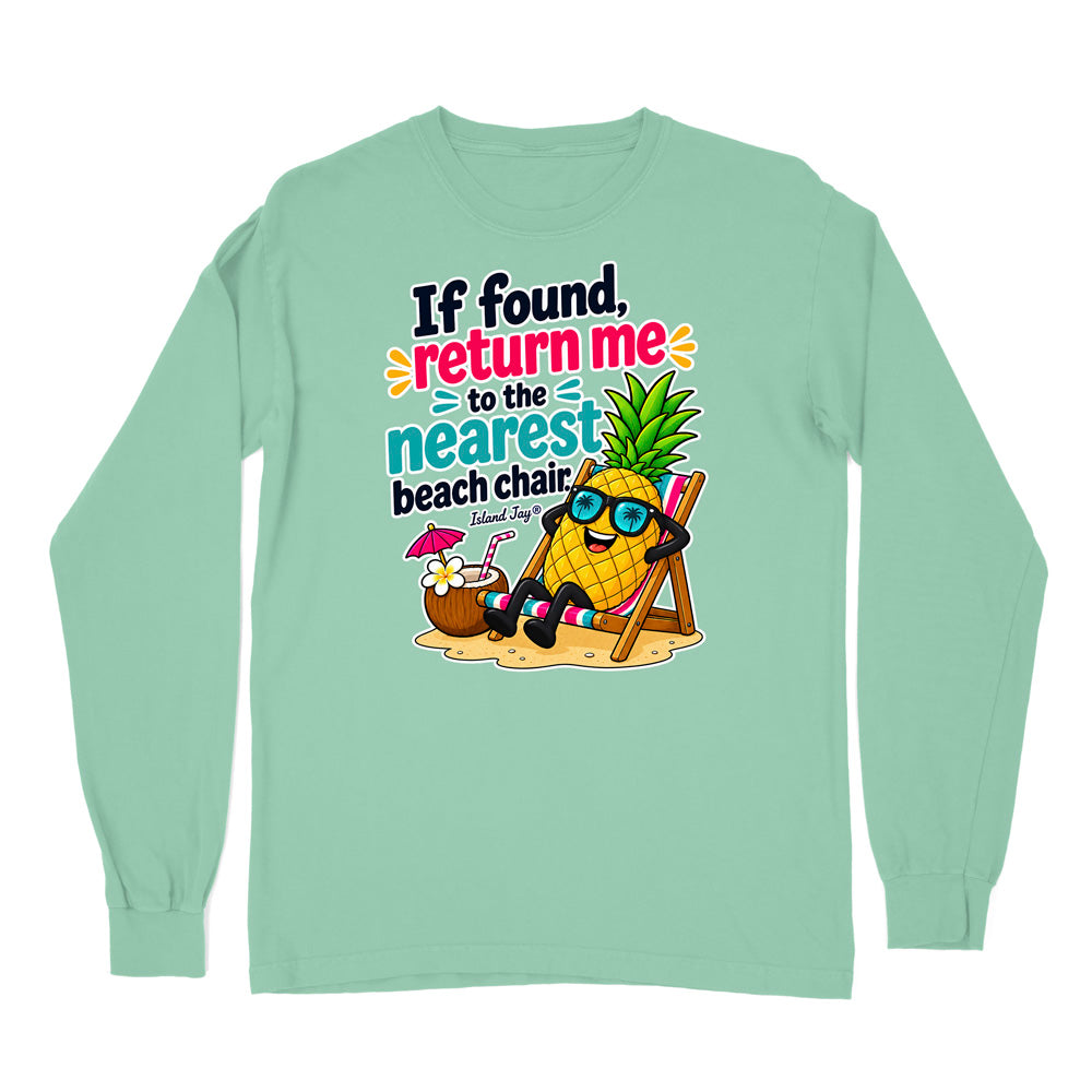 A mint green long-sleeve t-shirt with a colorful graphic print on the front. The graphic features a cartoon pineapple wearing sunglasses and reclining in a beach chair next to a coconut drink, with the text 'If found, return me to the nearest beach chair' and 'Ecuador Surf'.