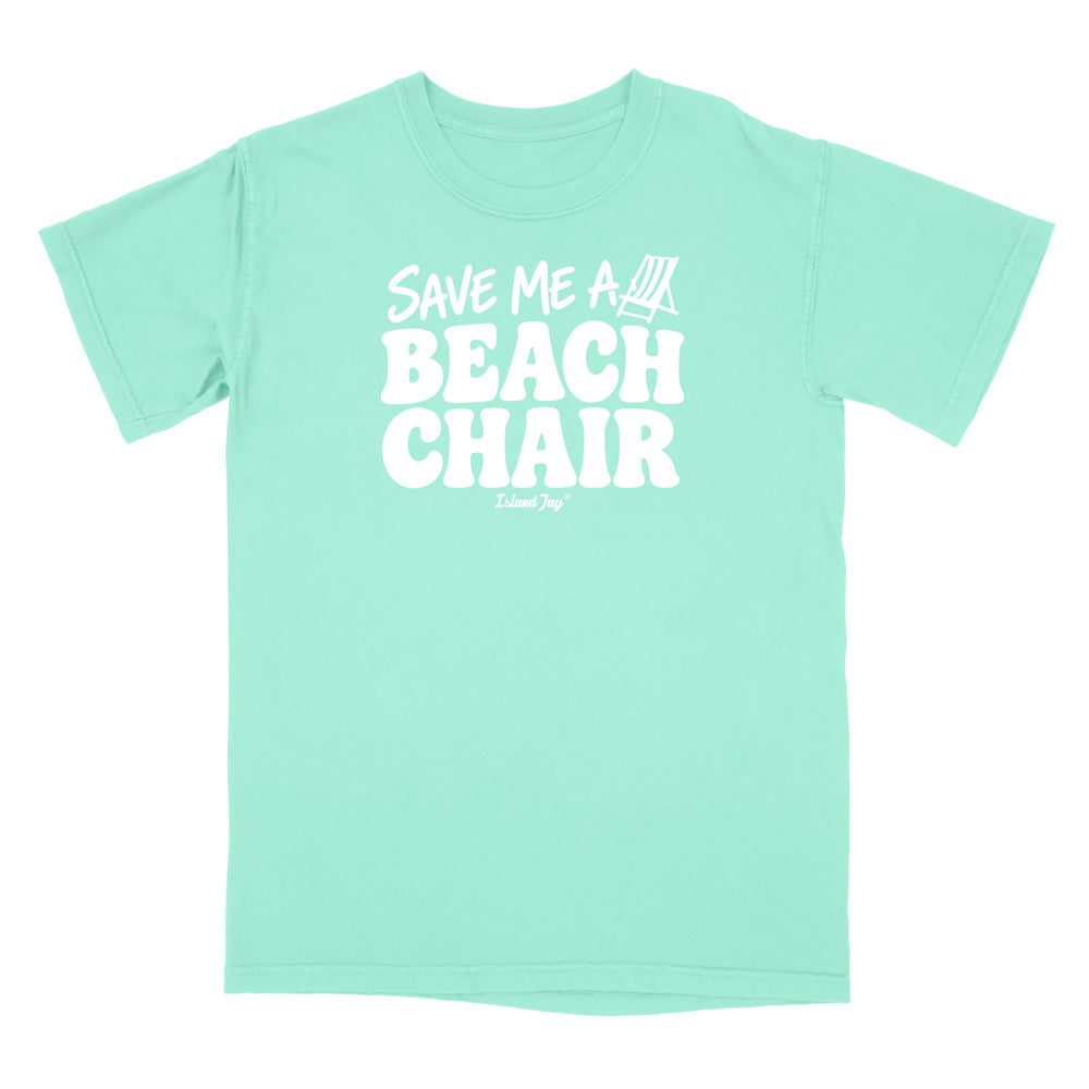 A mint green short-sleeve t-shirt with a bold white graphic on the chest reading 'SAVE ME A BEACH CHAIR' 