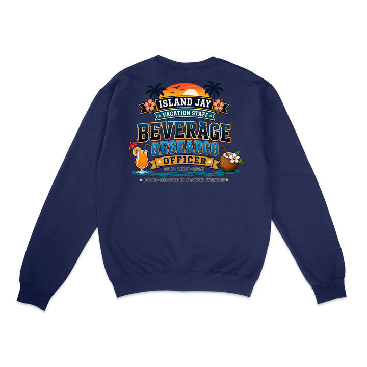 A navy blue crewneck sweatshirt shown from the back, featuring a colorful graphic print with a sunset, palm trees, and the text 'ISLAND JAY VACATION STAFF BEVERAGE RESEARCH OFFICER'.