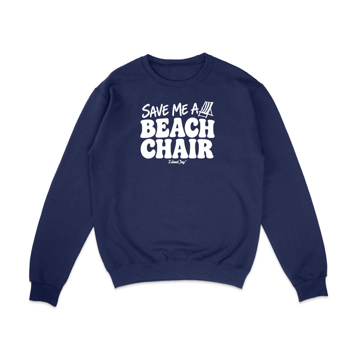 A navy blue crewneck sweatshirt with a white graphic print on the chest that reads 'SAVE ME A BEACH CHAIR' 