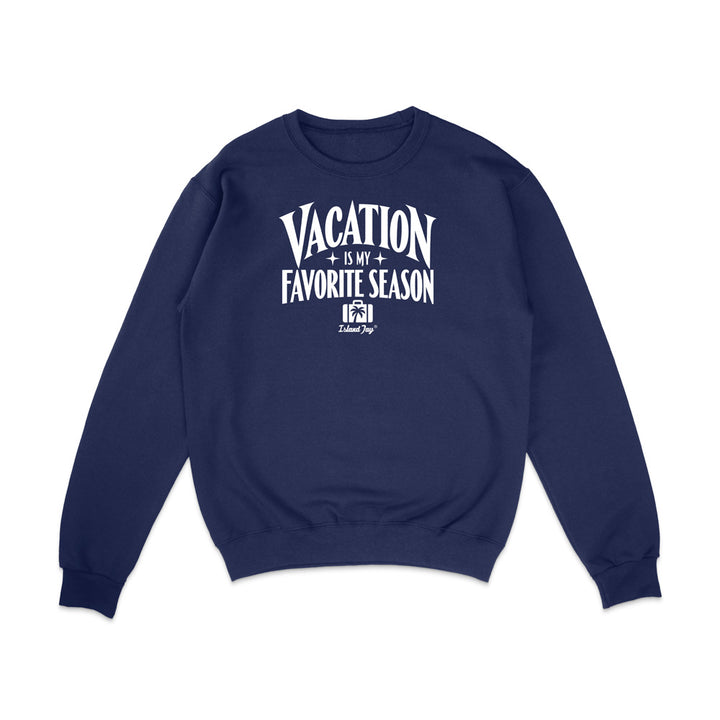 A navy blue crewneck sweatshirt with a white graphic text print on the chest reading 'VACATION IS MY FAVORITE SEASON' and a small 'Krazy Style' logo underneath, displayed on a clean white background.