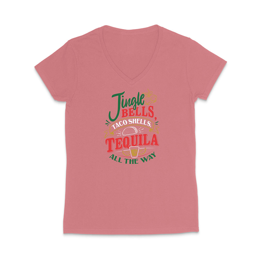 Pink t-shirt with colorful text design reading "Jingle Bells Taco Shells Tequila All The Way" on a white background