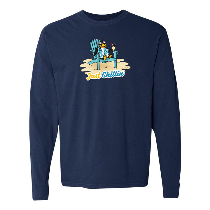 Navy long-sleeve shirt with a graphic of a penguin in an armchair and 'Just Chillin' text.