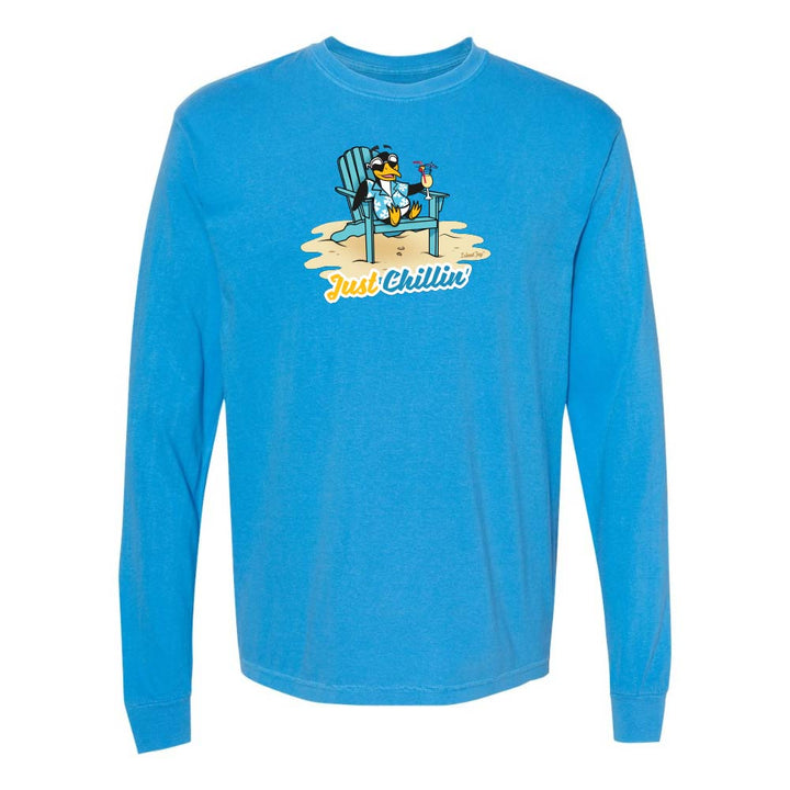Blue long-sleeve shirt with a graphic of a penguin in an armchair and 'Just Chillin' text.