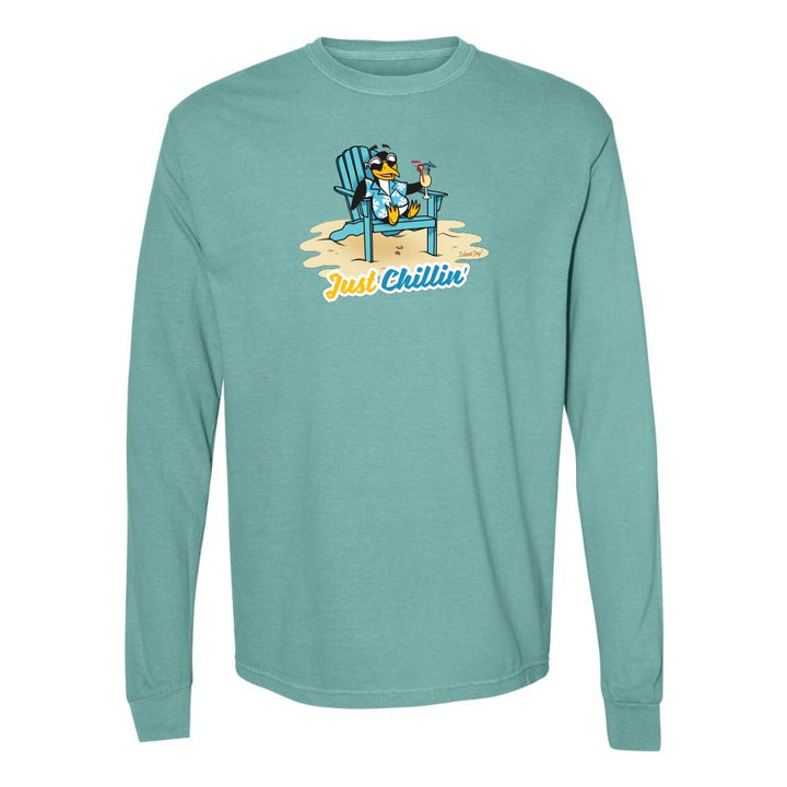Teal long-sleeve shirt with a graphic of a penguin in an armchair and 'Just Chillin' text.