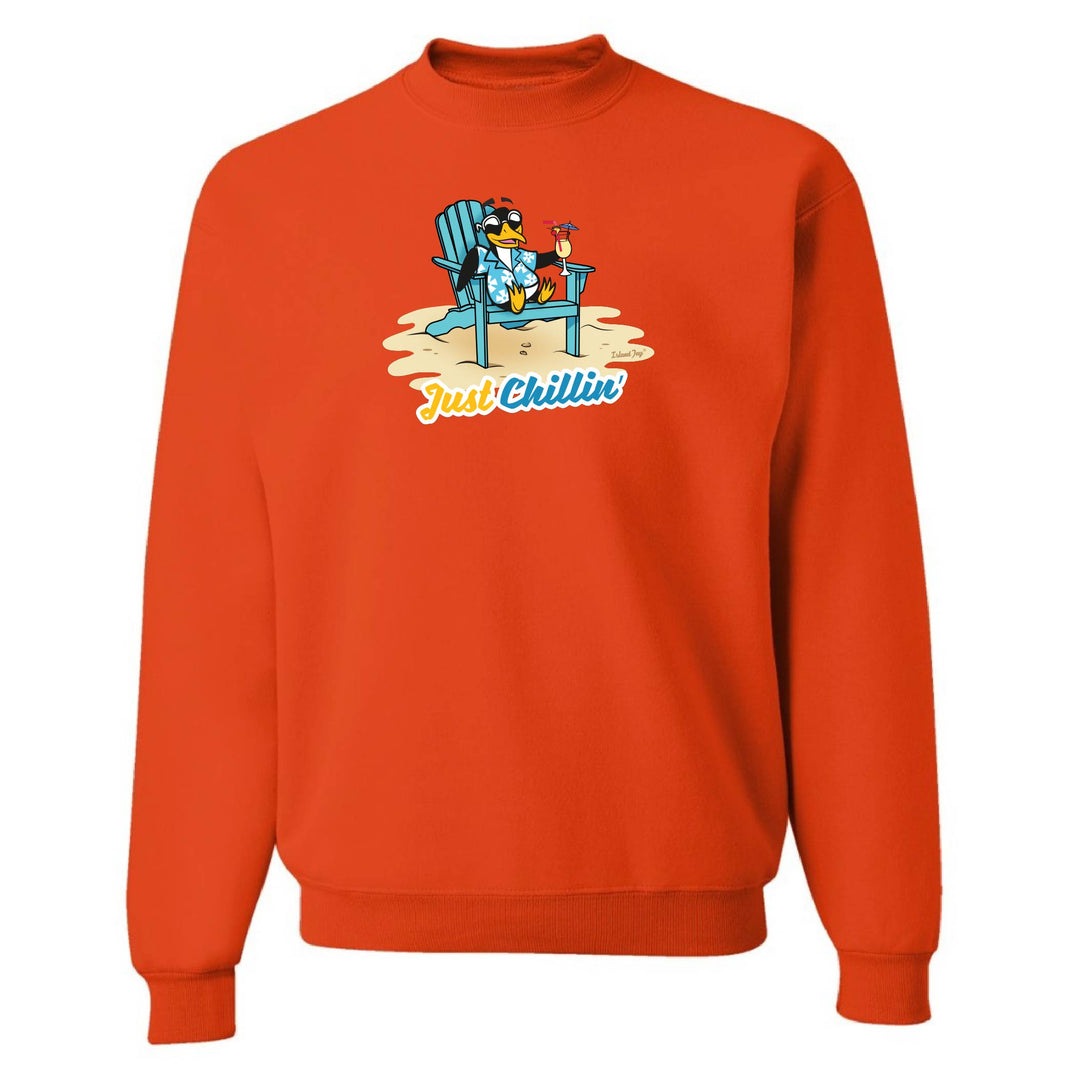 Orange sweatshirt with a graphic of a penguin in a chair and 'Just Chillin' text on a white background