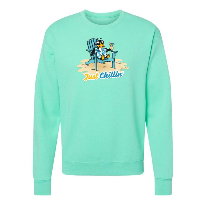 Mint green sweatshirt with a graphic of a penguin in an Adirondack chair and 'Just Chillin' text on a white background.