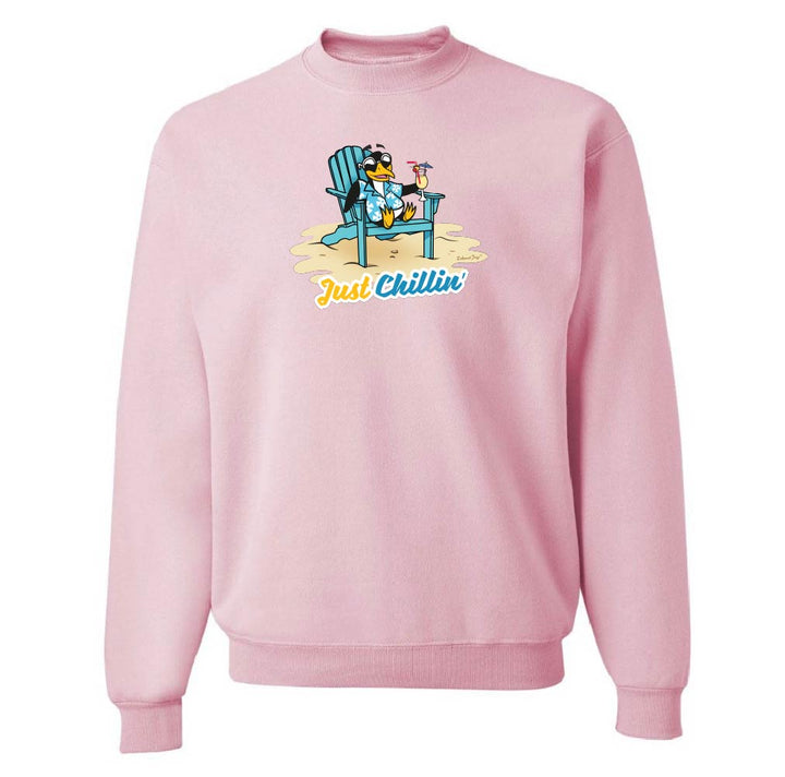 Pink sweatshirt with a penguin on a blue chair and 'Just Chillin' text.