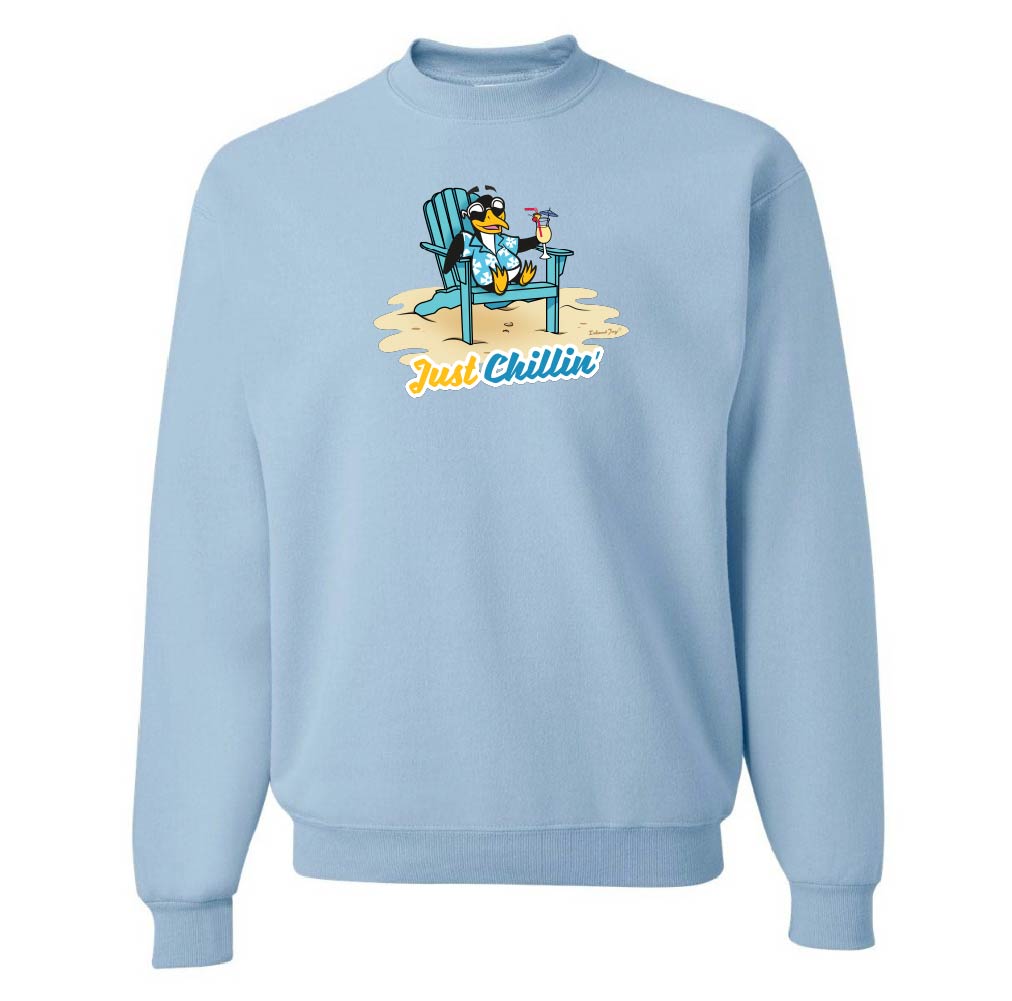 Light blue sweatshirt with cartoon design of a penguin on a beach chair and 'Just Chillin' text.