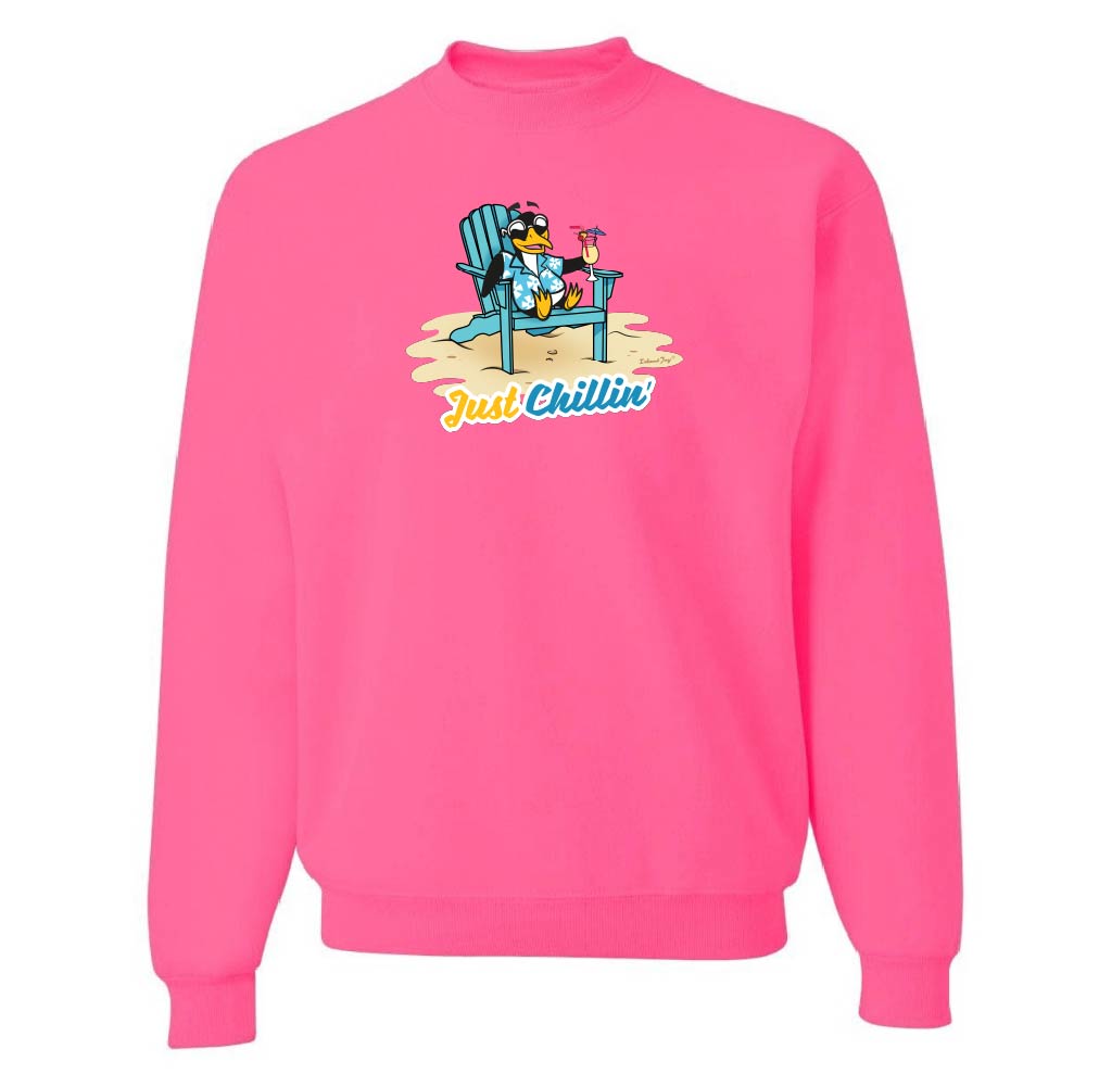 Pink sweatshirt with a graphic of a cartoon penguin on a beach chair and 'Just Chillin'' text.