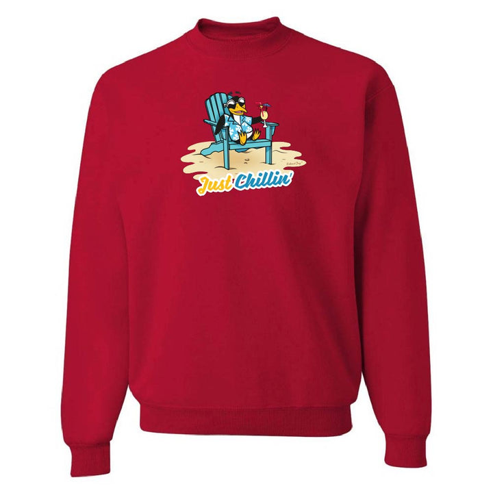 Red sweatshirt with a graphic of a penguin in a chair and 'Just Chillin' text on a white background