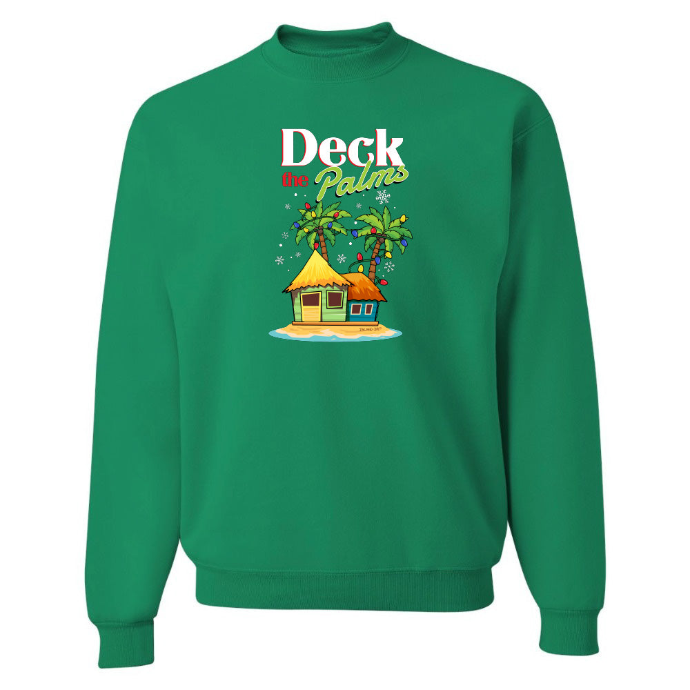 Green sweatshirt with a tropical hut and palm tree design and graphic text reading "Deck The Palms" on a white background