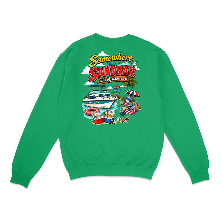 A bright green crewneck sweatshirt shown from the back, featuring a colorful graphic print with the text 'Somewhere in Sandbar With My Name on It' and illustrations of a boat, beach umbrella, and pool.