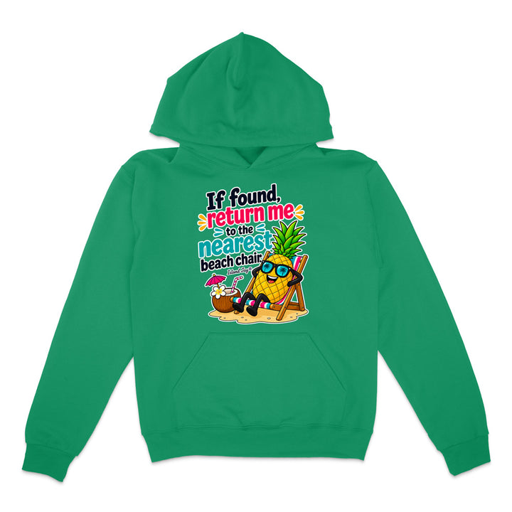 A green pullover hoodie with a colorful graphic on the chest featuring a pineapple character wearing sunglasses and a beach chair next to a coconut drink, with the text 'If found return me to the nearest beach chair'.