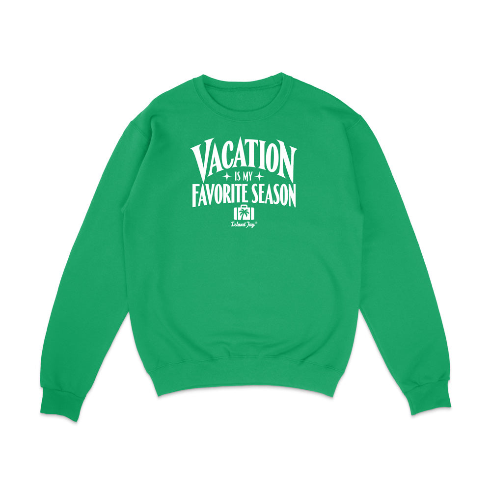 A bright green crewneck sweatshirt with a white graphic text print on the chest reading 'VACATION IS MY FAVORITE SEASON' and a small 'Krazy' logo underneath, displayed on a clean white background.